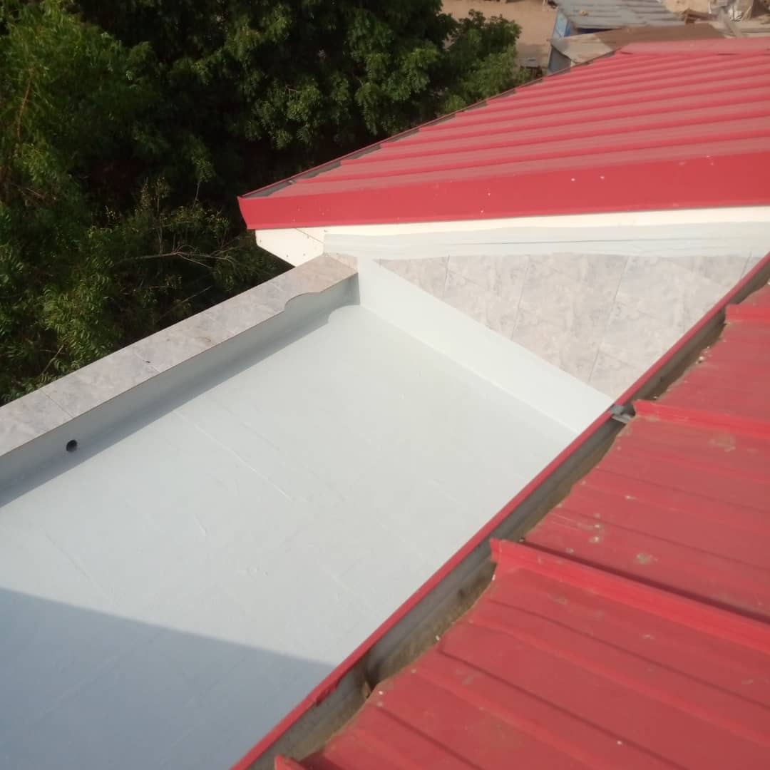 Finished box gutter waterproofing between two pitched metal roofs