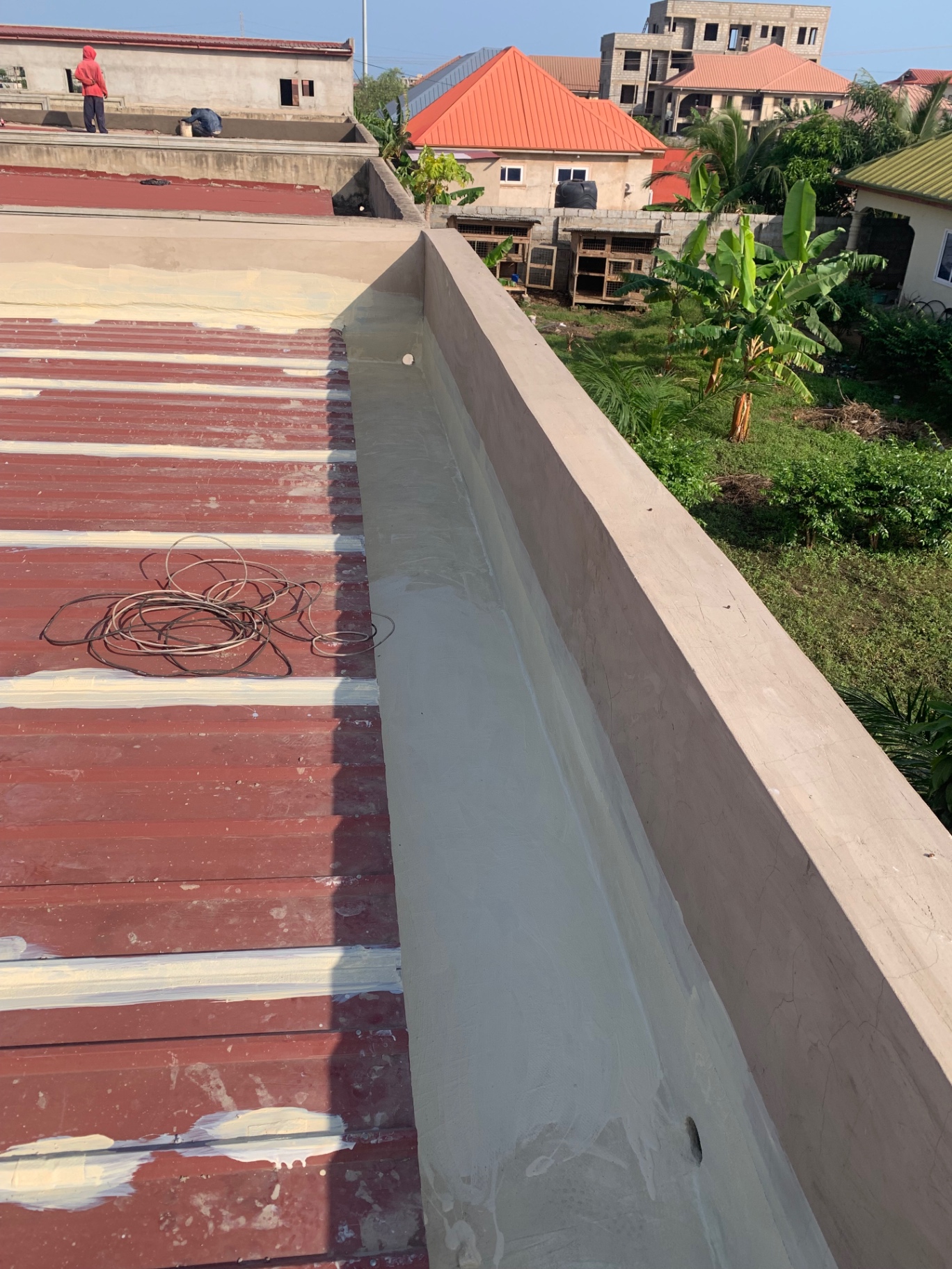 Parapet wall waterproofing and metal roof treatment