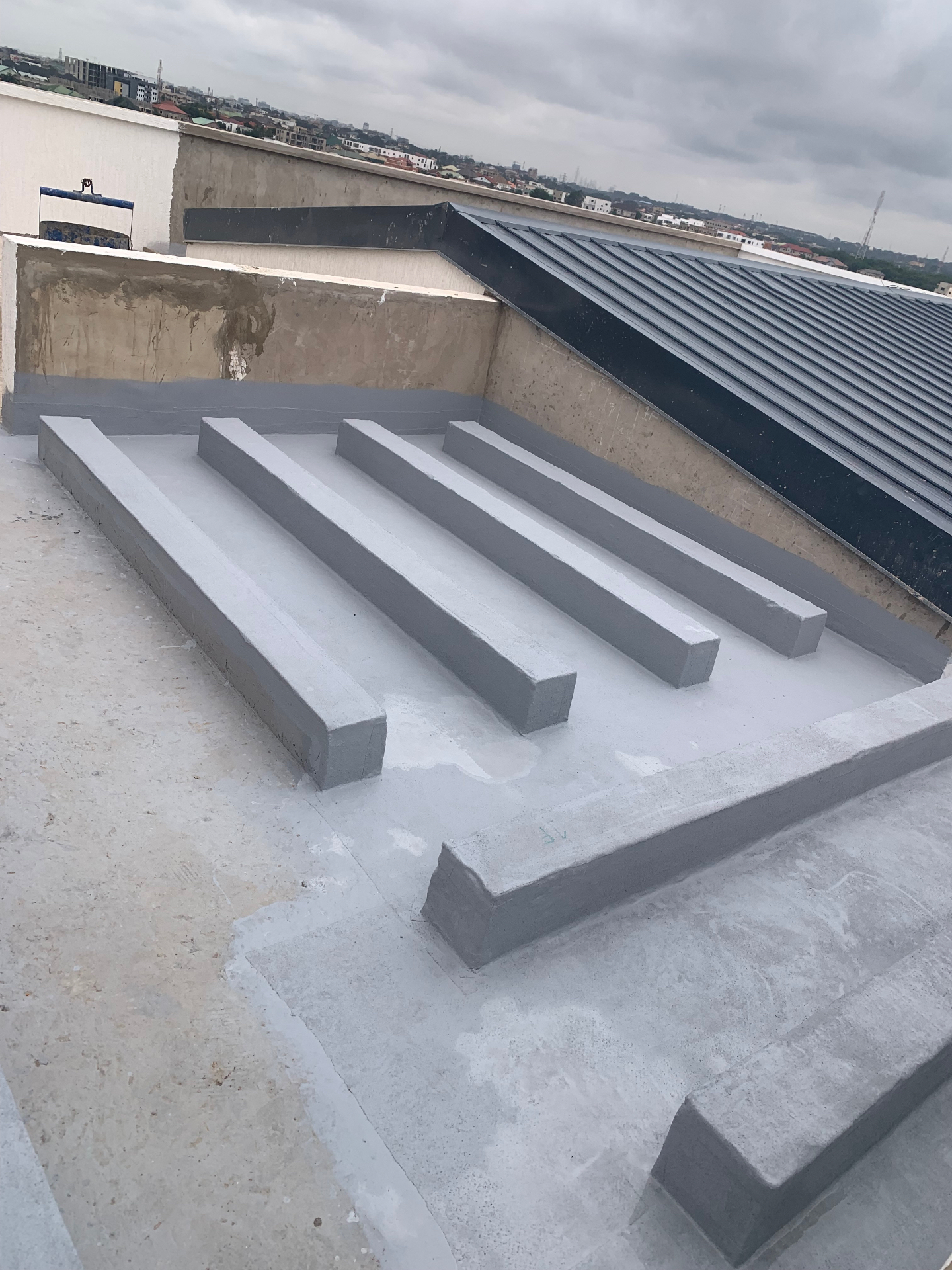 Rooftop concrete plinths and gutter waterproofing finish