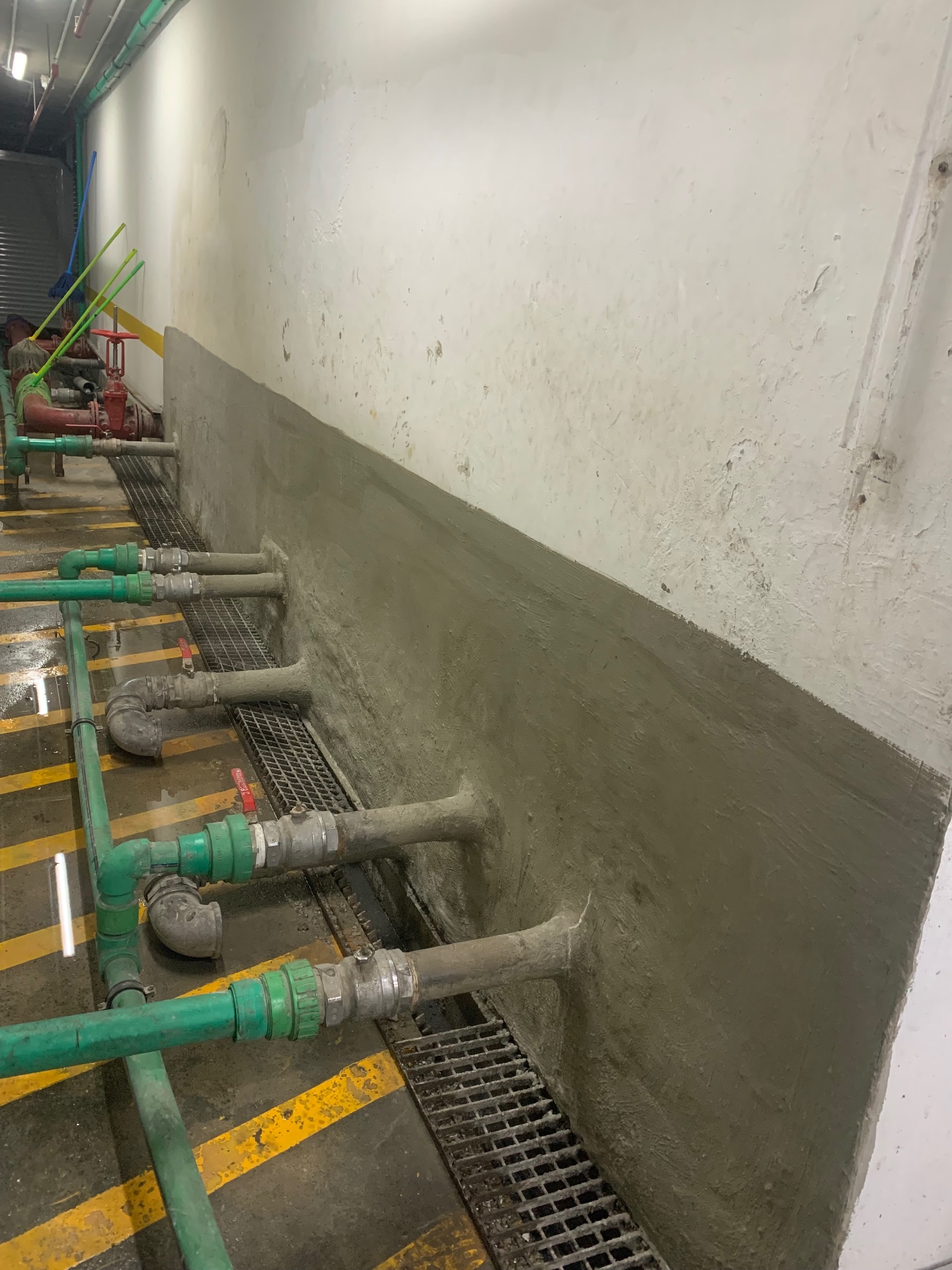 Cementitious waterproof render on basement plant room wall