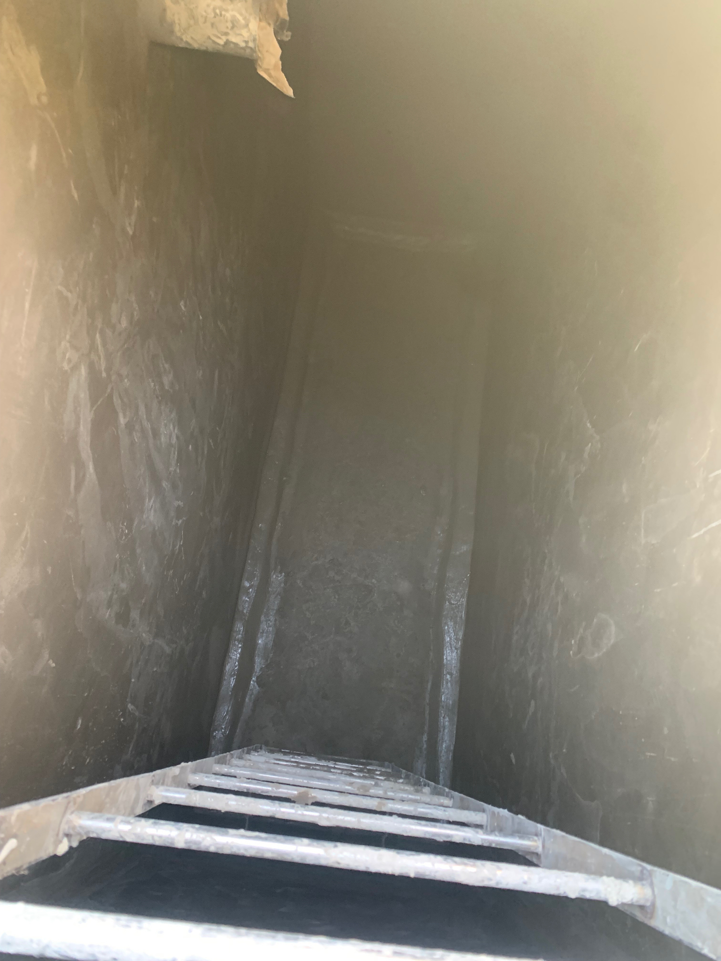Interior lift shaft waterproof lining with cementitious coating